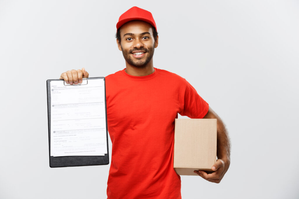 delivery concept portrait handsome african american delivery man courier showing confirmation document form sign isolated grey studio background copy space